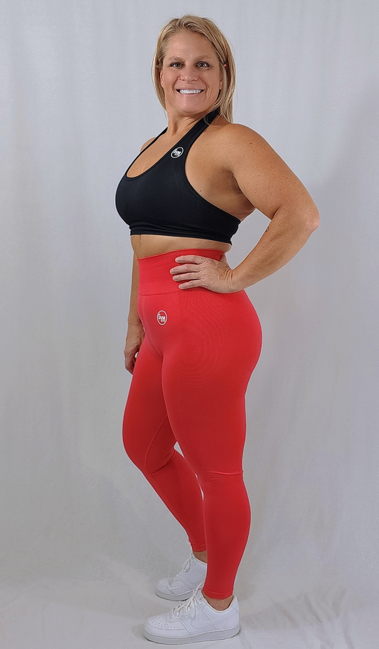 Gym Brand Apparel red leggings and black halter sports bra side view.