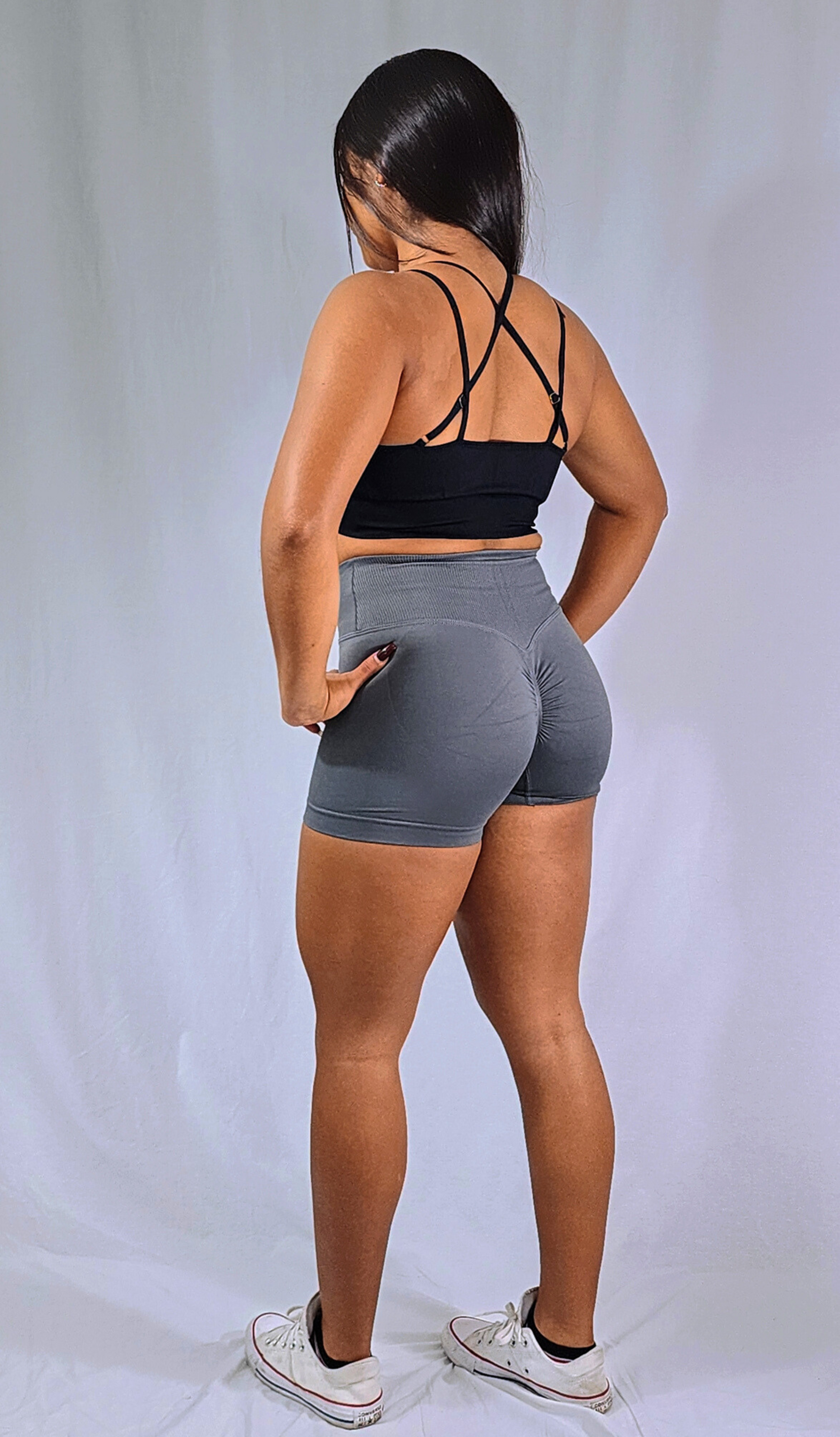 Gym Brand Apparel grey shorts and black strap back sports bra back view.