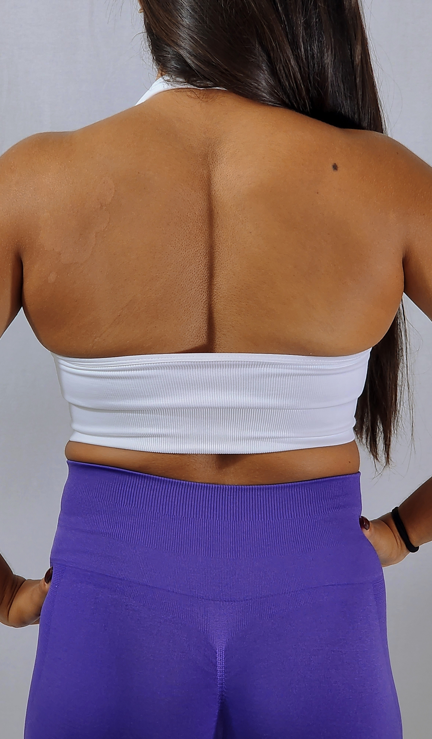 Gym Brand Apparel white halter sports bra back view.